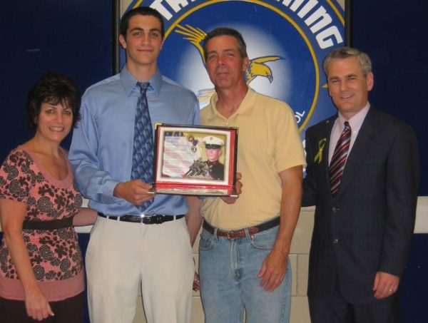 Presenting Eric's scholarship to Dan Godio and his parents Steve and Patty
