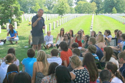 Eric's dad speaking to Mona Shores students at Eric's gravesite