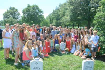 Mona Shores students gathered around Eric's gravesite