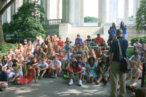 Teacher Eric Wahlberg addressing Mona Shore students outside the Tomb of the Unknown Soldier