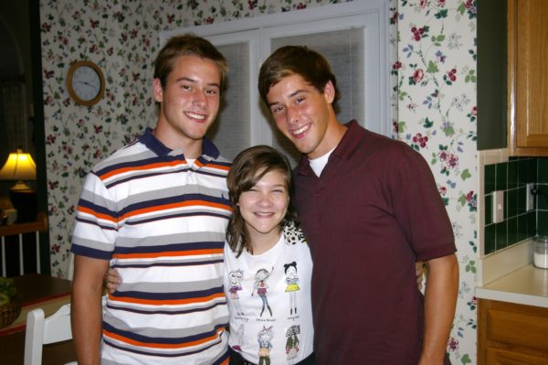 Nick (on the left) with brother Michael and Eric's step-sister Melanie
